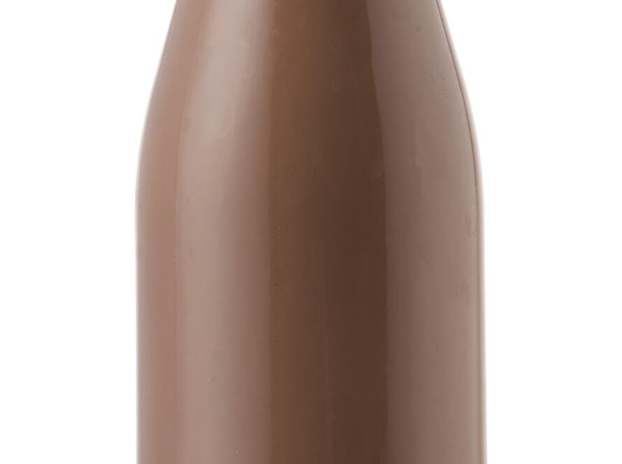 Glass bottle of chocolate milk isolated on white